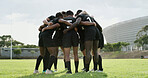 Men, rugby and huddle with scrum on grass field for team building, motivation or unity together. Active, male people or group of athletes or players in circle for match start or game preparation
