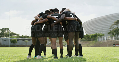 Buy stock photo Men, rugby and huddle with scrum on grass field for team building, motivation or unity together. Active, male people or group of athletes or players in circle for match start or game preparation