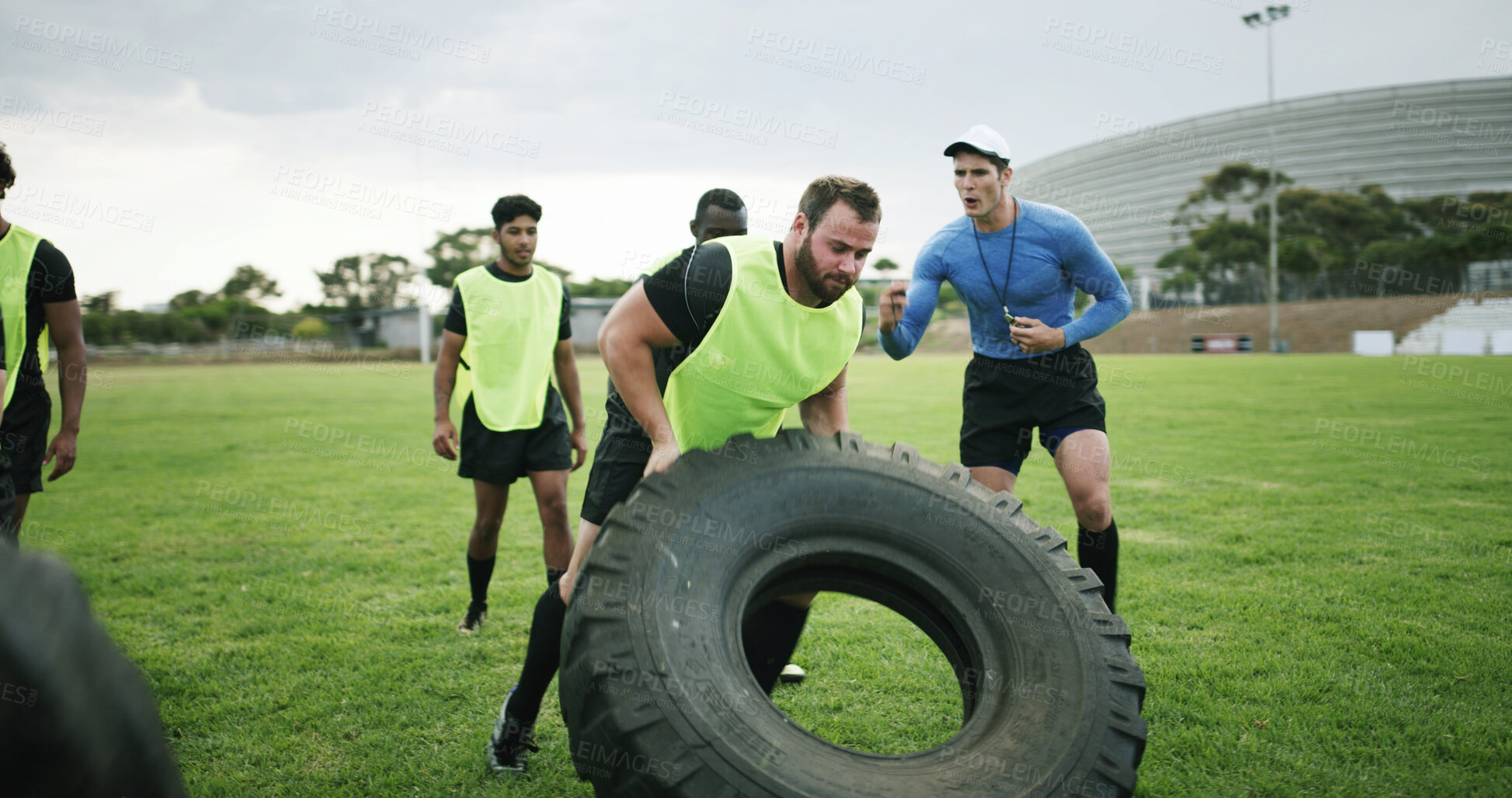 Buy stock photo Fitness, coach and people with tire on field, strength challenge and training for sport competition. Coaching, trainer and rugby players with exercise for muscle development, active and weightlifting
