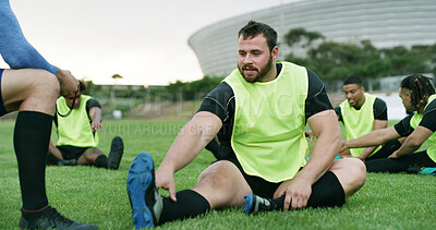 Buy stock photo Coach, stretching or man with practice on field, sports training or warm up routine for preparation. Outdoor, instructor or people with leg exercise for mobility, rugby club or getting ready for game