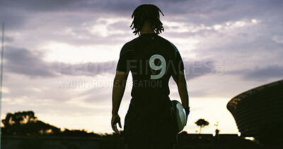 Buy stock photo Rugby, thinking and man outdoor with ball, goal mindset and daydreaming in fitness hobby. Sunset, back and player with space, athlete reflection and performance perspective in collision sport.