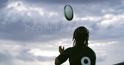 Buy stock photo Ball, catch and rugby with man outdoor for competition, game or sports match from back. Fitness, gray sky and space with player in winter weather for practice, training or skills development