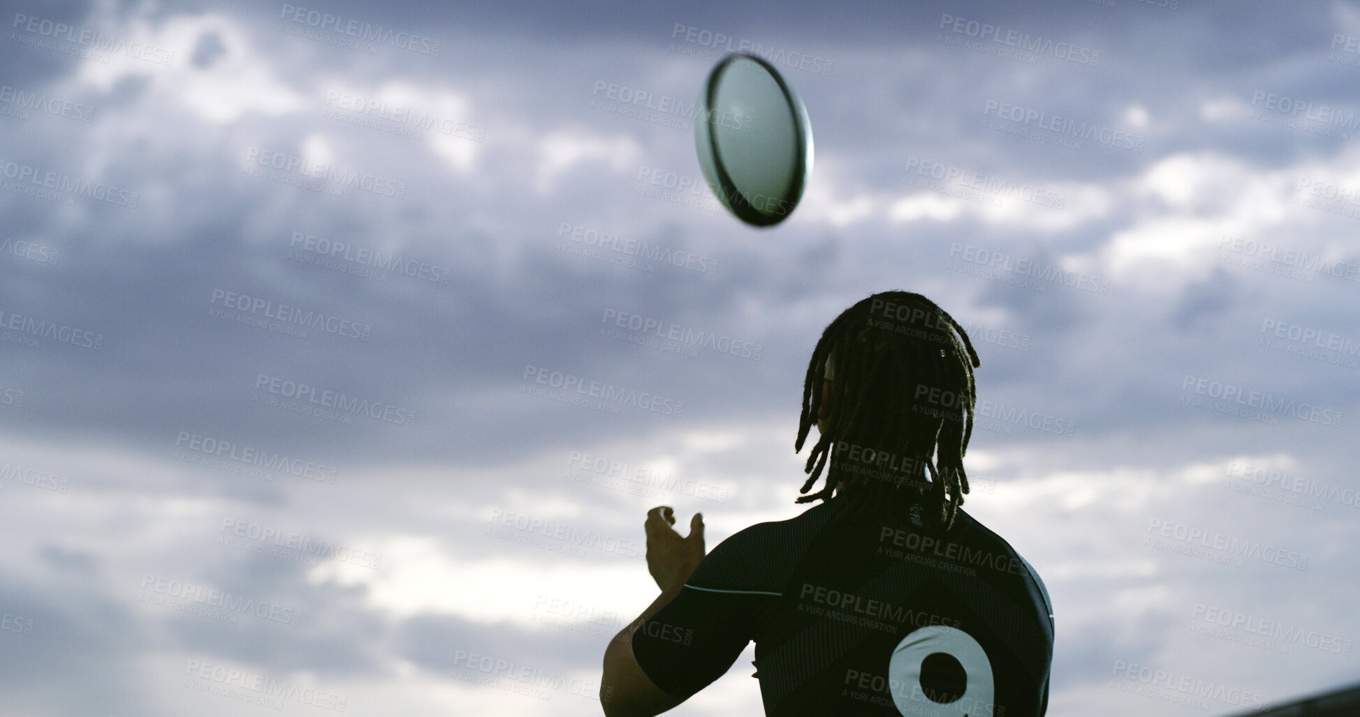 Buy stock photo Ball, catch and rugby with man outdoor for competition, game or sports match from back. Fitness, gray sky and space with player in winter weather for practice, training or skills development