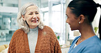 Talking, nurse and senior woman in hospital with smile, elderly care and medical checkup for wellness. Conversation, healthcare worker and old person with support for health, consultation and happy