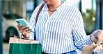 Phone, shopping bags and hands of woman in city with online sale, discount or promotion with retail. Technology, customer and female person with cellphone for ecommerce purchase in urban town.