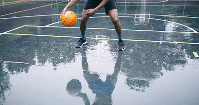 Buy stock photo Man, basketball and legs on court for training, workout and exercise for tournament. Player, reflection and healthy person with practice for fitness, skills development for dribble and competition