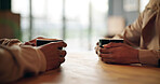 Hands, conversation and couple in cafe on date together for love, communication or anniversary. Connection, care or romantic people bonding in coffee shop for discussion, support and gratitude