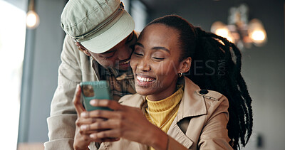 Buy stock photo Love, black couple and happy with phone in cafe for romantic date, text message and web browsing. Trust, people and smile with mobile app in coffee shop for social media, status update and affection