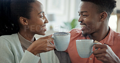 Buy stock photo Happy, couple and black people in home with coffee, connection or love bonding together in morning. Wellness, woman and man dating with smile for caring relationship, commitment or beverage in lounge
