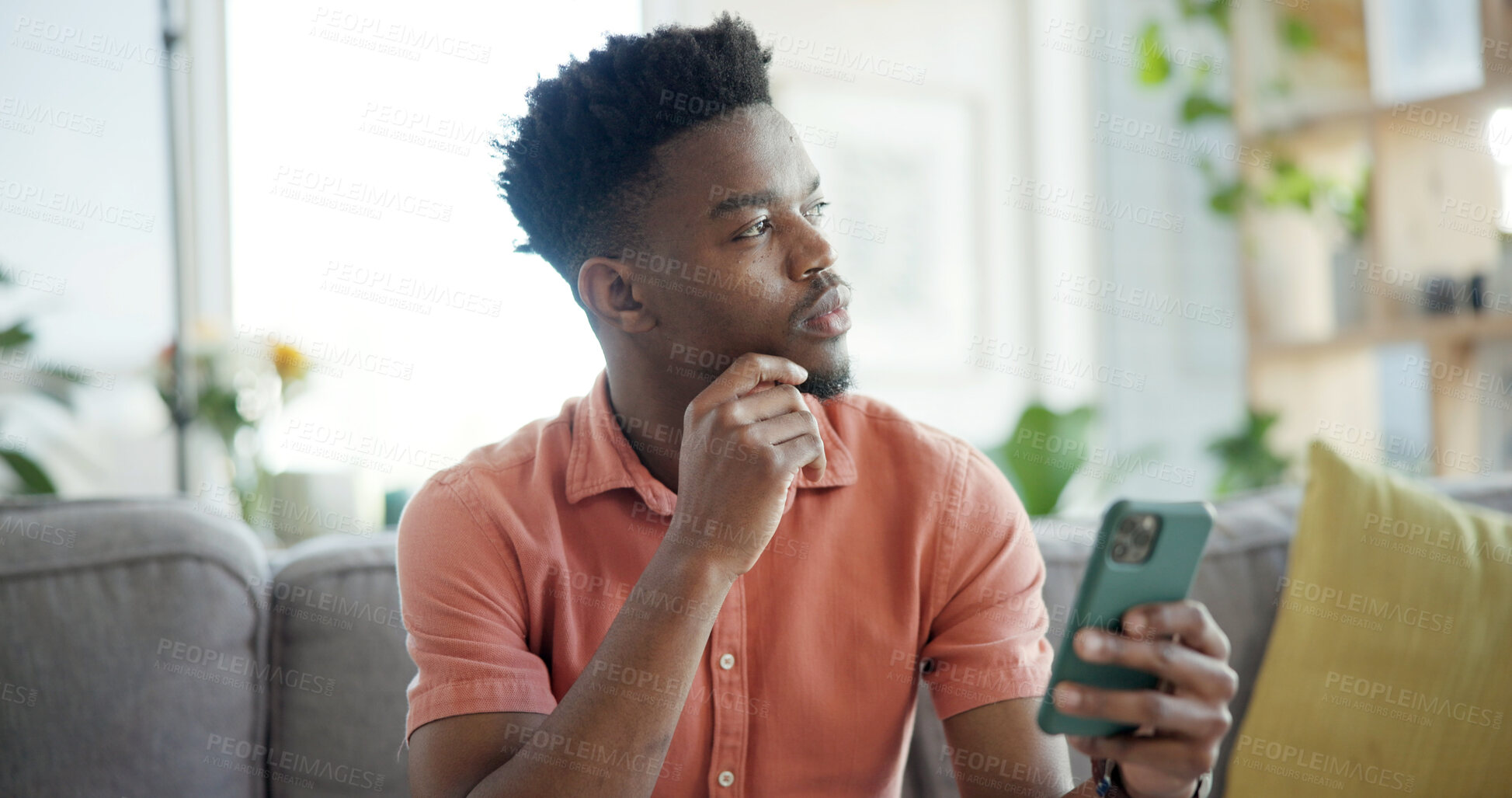 Buy stock photo Thinking, cellphone and black man on sofa in home with networking, connection or texting on mobile app. Relax, decision and African person with phone for chatting, communication or social media.