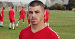Serious, fitness and portrait of soccer player on field for game, workout or training with championship. Sports, man and athlete with confidence for football match, exercise or practice outdoor.