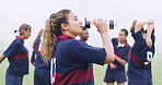 Drinking, water and rugby with woman on field for training break, hydration and competition practice. Electrolyte, match rest and exercise fatigue with person outdoor for sports, wellness and energy