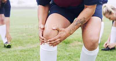 Buy stock photo Knee, pain and rugby with hands of woman on field for sports injury, inflammation and strain. Training accident, athlete emergency and tension with legs of person outdoor for fibromyalgia and hurt