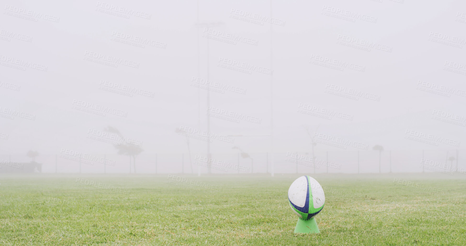 Buy stock photo Rugby, mist and fitness with ball on field for competition practice, kick off and sports tournament. Game event, match pitch and fog with equipment in stadium outdoor for mockup, hobby and score