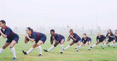 Buy stock photo Teamwork, rugby and squat with women on field for competition practice, training start and stretching. Exercise preparation, warm up and sports club with people outdoor for muscle and match health