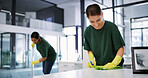 Women, cleaning or office with detergent for hygiene, bacteria or germ removal in workplace. Happy, female people or cleaners wiping surface with smile for disinfection or sanitary workspace together