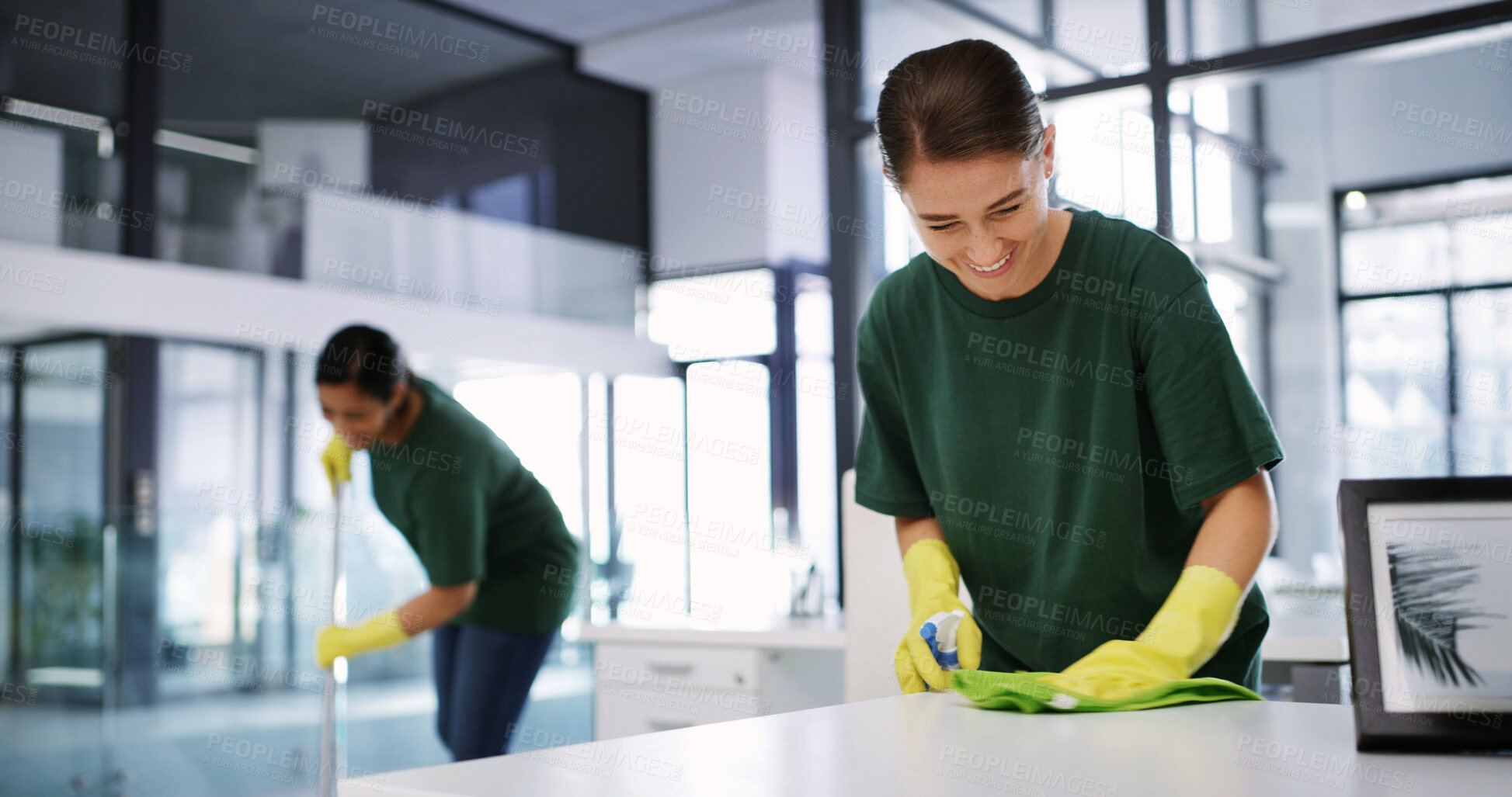 Buy stock photo Women, cleaning or office with detergent for hygiene, bacteria or germ removal in workplace. Happy, female people or cleaners wiping surface with smile for disinfection or sanitary workspace together