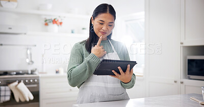 Buy stock photo Baking, thinking and woman with tablet in kitchen, meal inspiration and smile for cuisine tutorial. Tech, reading and Asian person with idea for recipe adaptation, food blog and cooking video in home