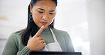 Cooking, thinking and woman with tablet in kitchen, meal inspiration and serious for cuisine tutorial. Tech, reading or Asian person with idea for recipe adaptation, food blog or baking video in home