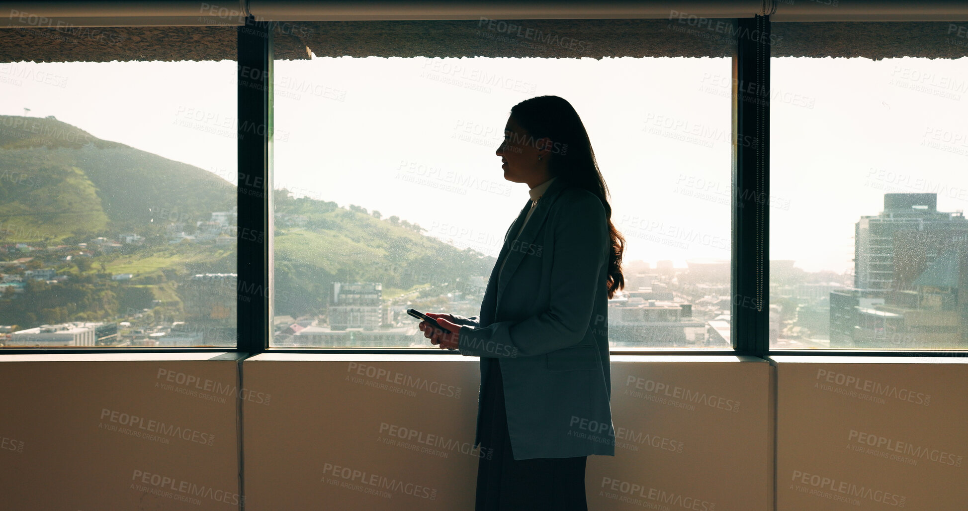 Buy stock photo Business woman, phone and window in office building for thinking, problem solving and corporate job. Employee, technology and person waiting for communication, feedback or results for city project