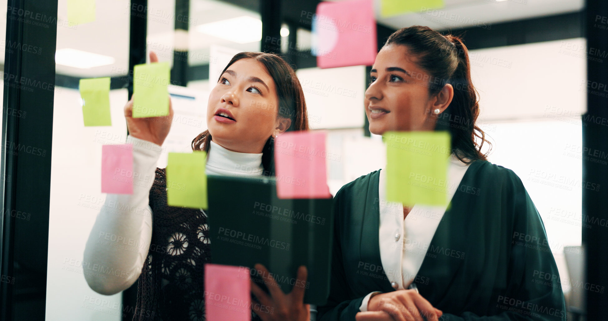 Buy stock photo Women, planning and sticky note with tablet in office, glass wall or strategy at finance agency. Happy people, broker and team with tech, problem solving or insight on app at asset management company