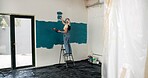 Woman, ladder and painting for renovation with wall, creative and color for property development. Person, interior design, tools and equipment with stroke, maintenance and brush for home improvement