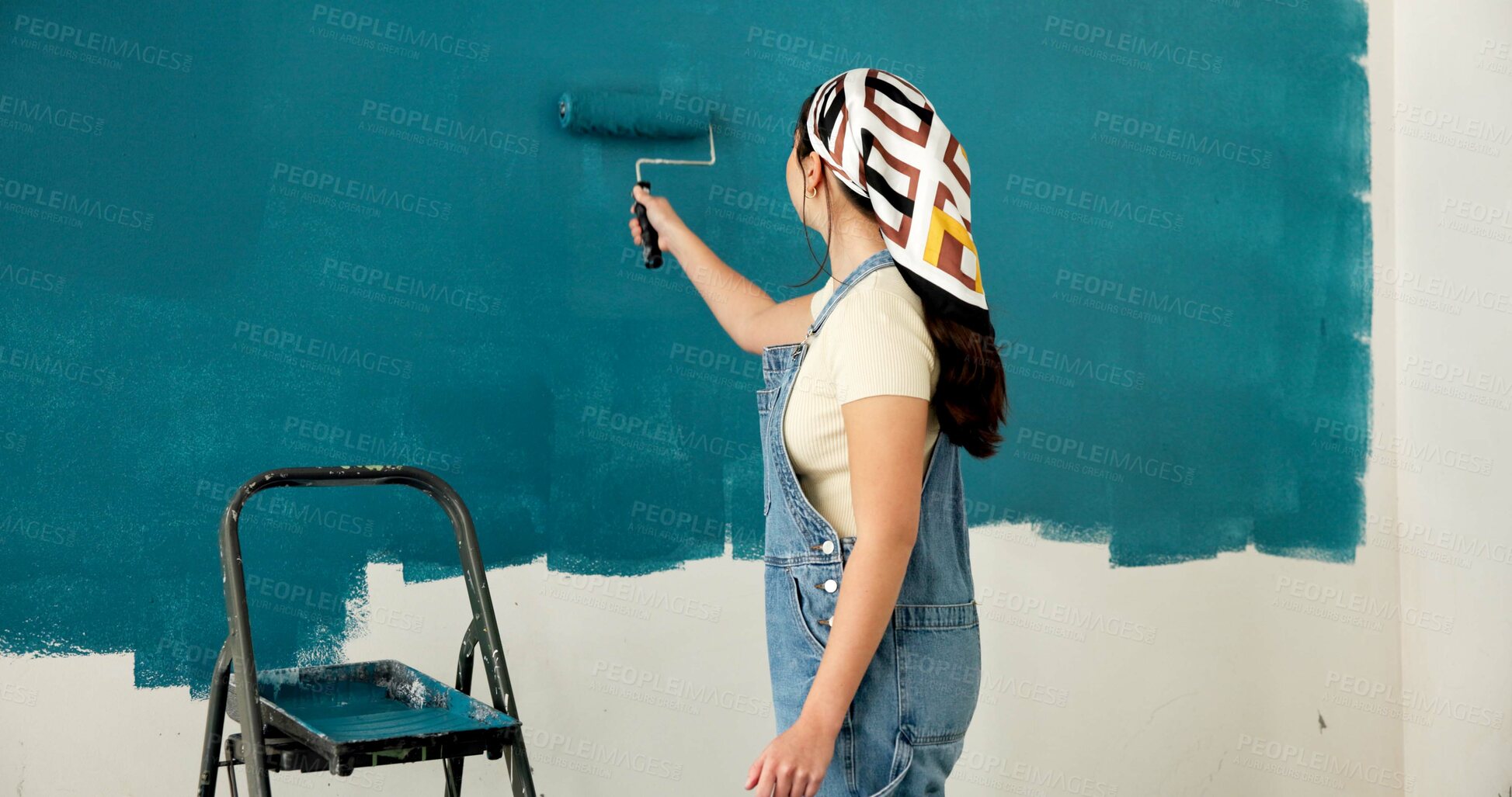 Buy stock photo Woman, roller and painting wall with stroke, remodeling and creativity for decoration from back. Person, interior design and renovation with space, maintenance gear and brush for home improvement