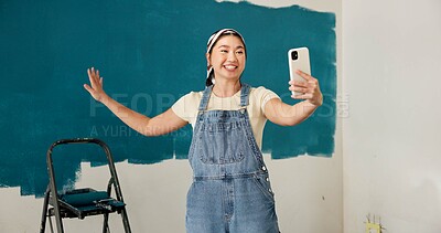 Buy stock photo Woman, selfie and progress with smile, renovation and paint job for property development. Asian person, interior design and remodeling with photography, social media and touch for home improvement