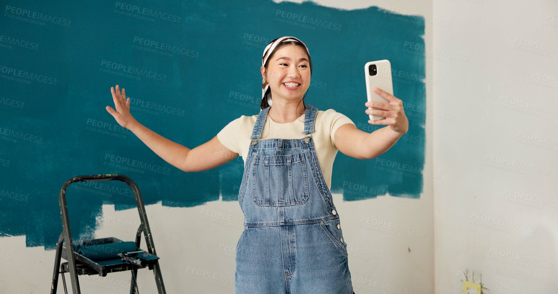 Buy stock photo Woman, selfie and progress with smile, renovation and paint job for property development. Asian person, interior design and remodeling with photography, social media and touch for home improvement