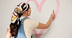 Painting, remodeling and back of woman for home decoration, creativity and interior design. House, painter and person with color, shape and paintbrush for inspiration, diy and makeover for project