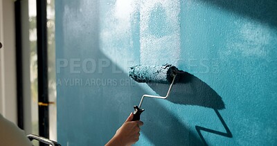 Buy stock photo Painting, wall and hands of person with roller for home decoration, interior design and diy project. House, blue and painter with color, paintbrush and inspiration for remodeling, upgrade and change