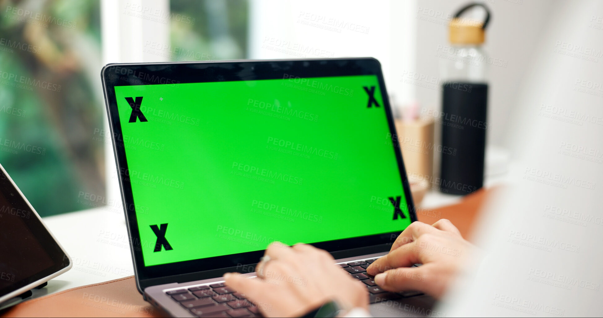 Buy stock photo Laptop, green screen and hands in home for remote work, website or creative research at desk. Tech display, mockup space or person on internet for business email, typing information and online review