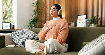 Buy stock photo Woman, breathe and headphones on sofa for meditation, spiritual healing or holistic audio for zen. Person, relax or eyes closed in home with calm music, inner peace or inhale guidance for mindfulness