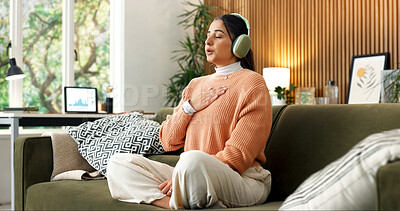Buy stock photo Woman, breathe and headphones in home for meditation, spiritual healing or holistic audio for zen. Person, rest or eyes closed on sofa with calm music, inner peace and inhale guidance for mindfulness