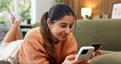 Buy stock photo Credit card, phone and woman on sofa for online shopping, subscription payment or transaction. Person, webshop or debit details for ecommerce, internet banking and mobile app for fintech at home