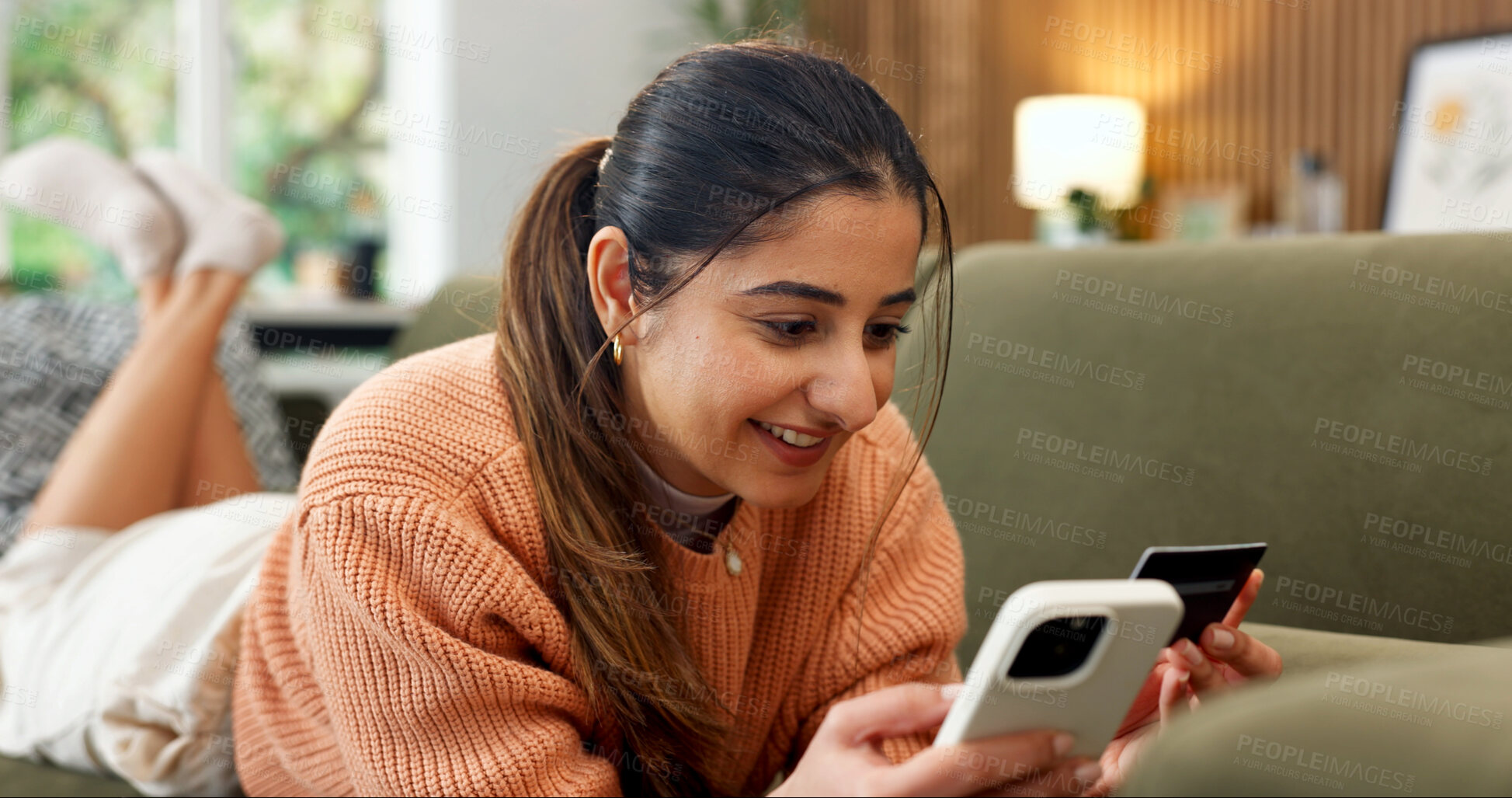 Buy stock photo Credit card, phone and woman on sofa for online shopping, subscription payment or transaction. Person, webshop or debit details for ecommerce, internet banking and mobile app for fintech at home