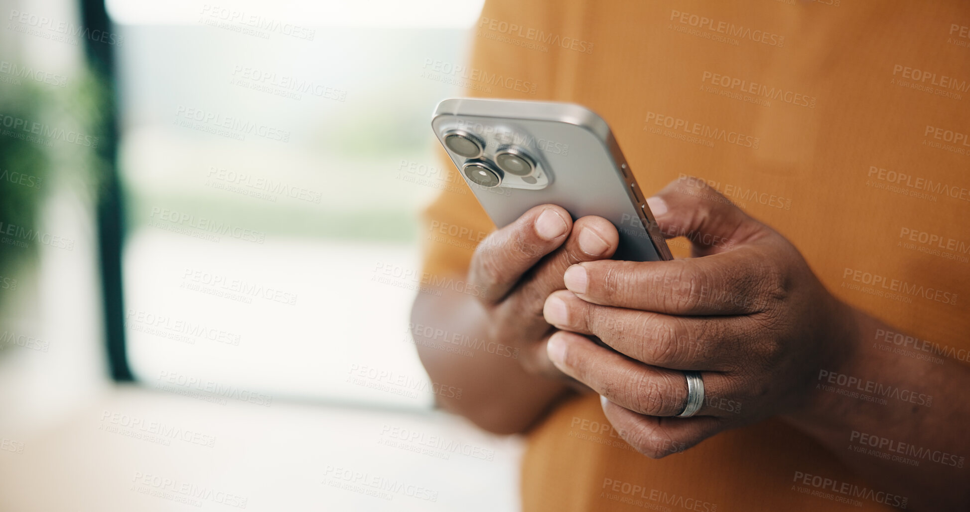 Buy stock photo Man, hands and typing with phone in home for social media, communication or network connection. Male person, chatting or texting with mobile smartphone for internet, app and online service in house
