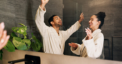 Buy stock photo Bathroom, happy couple and dance by mirror for care, morning routine and bonding together. Excited people, music and rhythm in home with reflection, singing and relationship wellness with partner