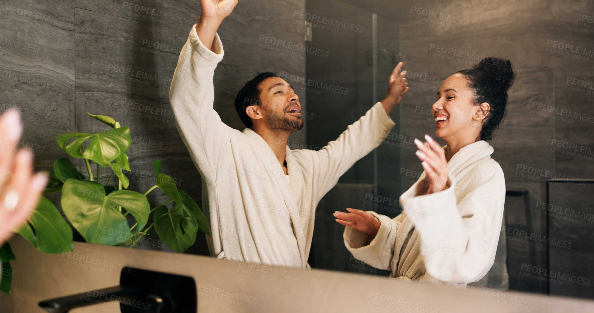 Buy stock photo Bathroom, happy couple and dance by mirror for care, morning routine and bonding together. Excited people, music and rhythm in home with reflection, singing and relationship wellness with partner