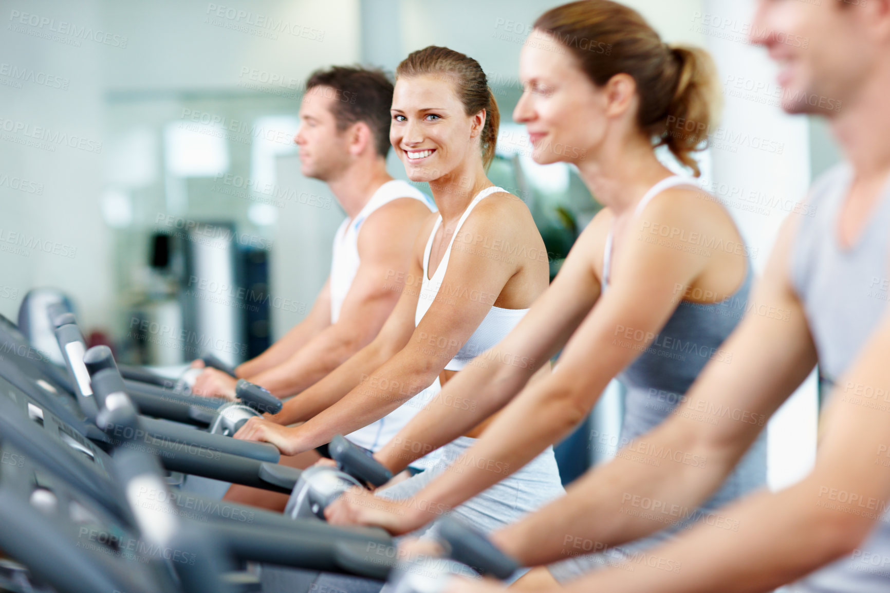 Buy stock photo Gym, health and happy woman on exercise bike, self care and training for muscle strength or fitness. Cycling, portrait and people on cardio machine, endurance and lose weight with workout routine
