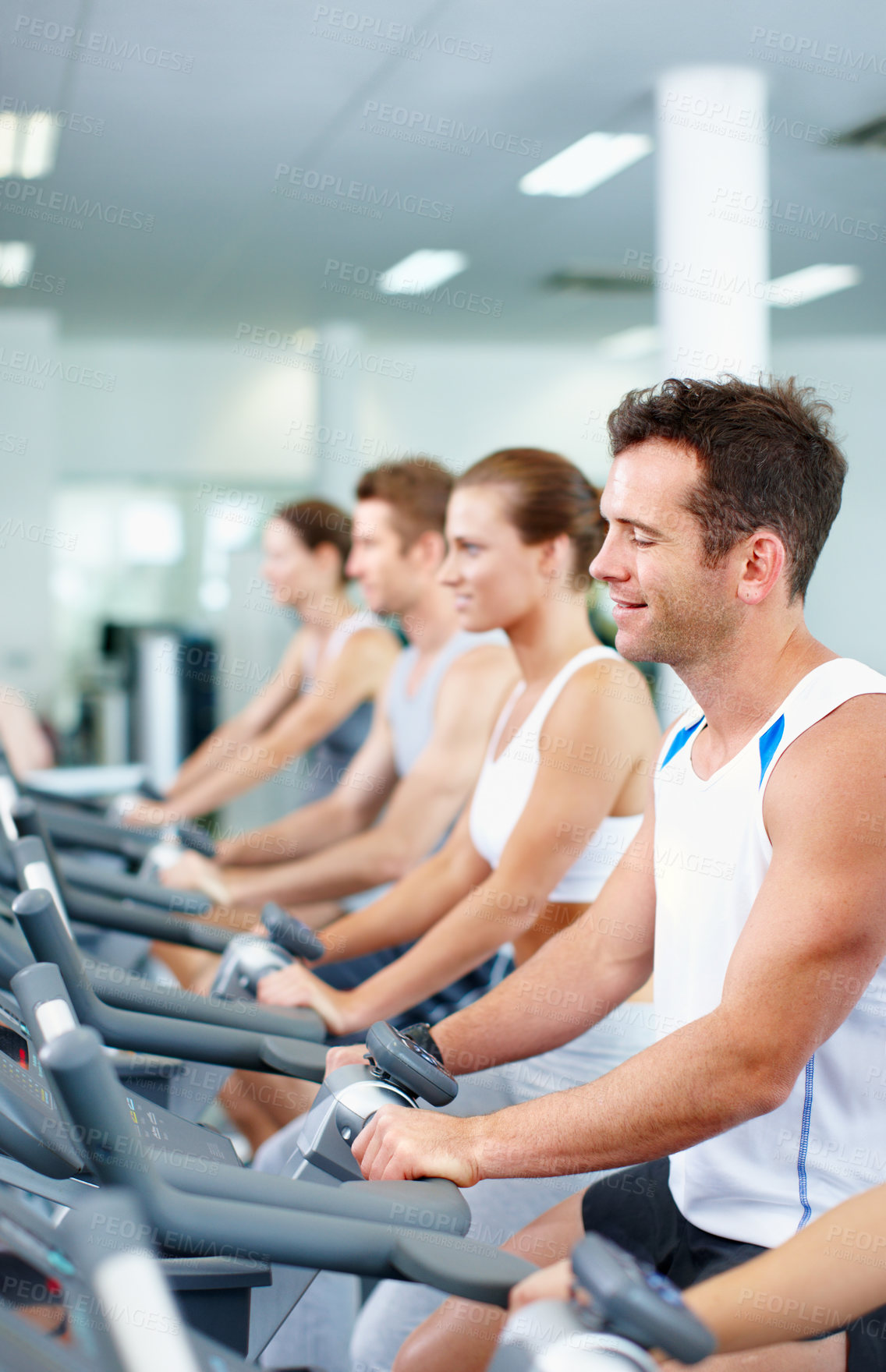 Buy stock photo Gym, cycling and happy people on exercise bike, self care and training for muscle strength or health. Fitness club, wellness and group on cardio machine, endurance or lose weight with workout routine