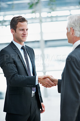 Buy stock photo Handshake, smile and business men in office with greeting, welcome or real estate agreement. Shaking hands, introduction and happy people with property investment, partnership deal or corporate trust