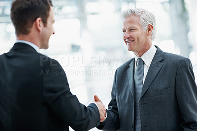 Buy stock photo Shaking hands, smile and business men with welcome, greeting or partnership for real estate agreement. Handshake, introduction and happy people in office with property investment, deal or meeting