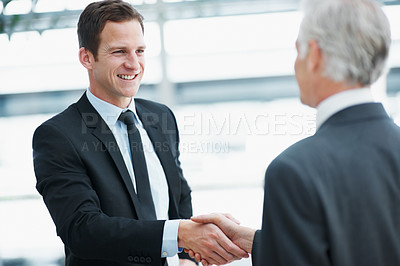 Buy stock photo Shaking hands, smile and business men with greeting, welcome or partnership for real estate agreement. Handshake, introduction and happy people in office with property investment, deal or meeting