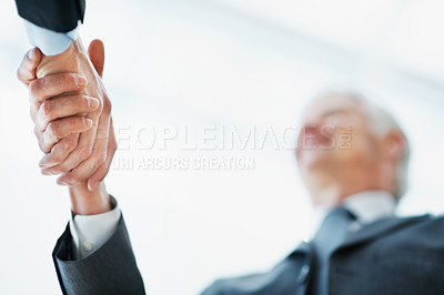 Buy stock photo Shaking hands, low angle and business man in office with financial merger, collaboration or agreement. Handshake, partnership and people with investment acquisition, deal or corporate consolidation