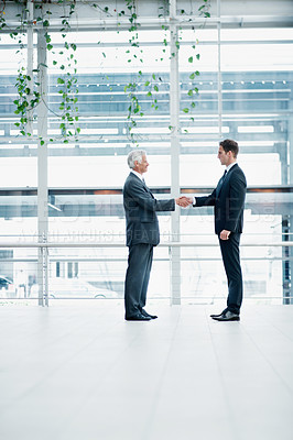 Buy stock photo Businessmen, meeting and deal with handshake in office for corporate partnership together. Male people, employees or colleagues shaking hands with introduction or greeting for b2b or work agreement