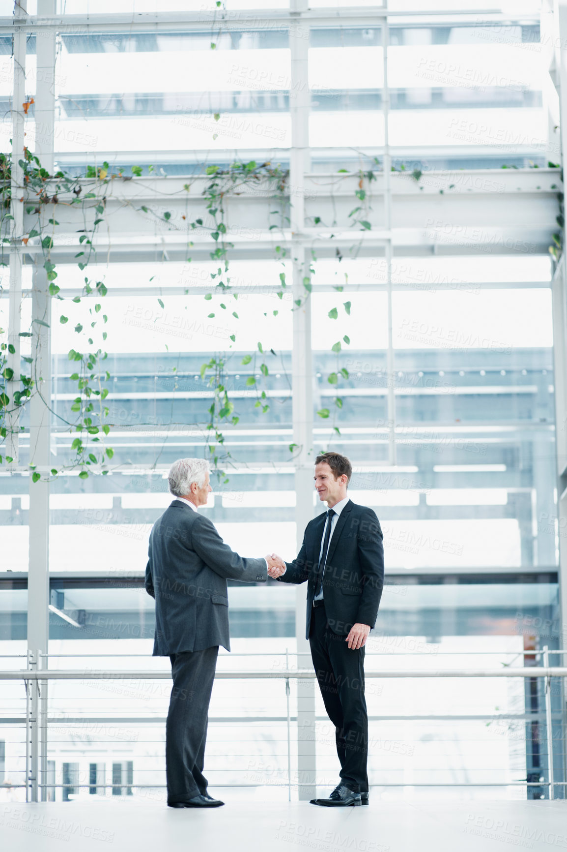 Buy stock photo Businessmen, meeting or partnership with handshake for corporate deal together in office. Male people, employees or colleagues shaking hands with introduction or greeting for agreement or negotiation