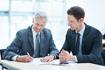 Buy stock photo Men, meeting and sign document at law firm for settlement agreement, lawyer approval and compliance. Attorney, people and paperwork signature in office for court case admin, policy and cooperation.