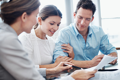 Buy stock photo Couple, documents and meeting with financial advisor for agreement, consulting or investment. Advice, finance and paperwork with broker talking to people in office for portfolio growth or update