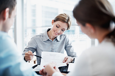 Buy stock photo Paperwork, couple and insurance advisor, holding hands and smile with application for policy. Man, woman and consultation with clients, documents and coverage contract for future security in office